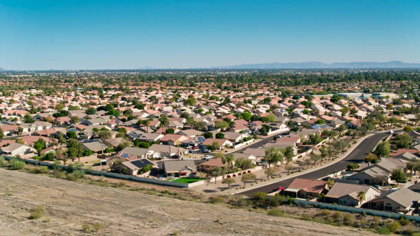 istock Drone Flight Over Suburb in Peoria with Phoenix Skyline in Distance 1402201320