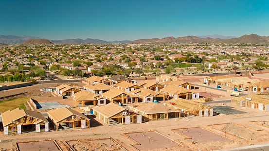 Aerial shot of housing construction in a growing residential neighborhood in Peoria, a suburb of Phoenix, on a sunny day.