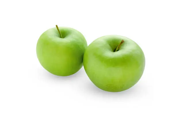 Two green apples isolated on white