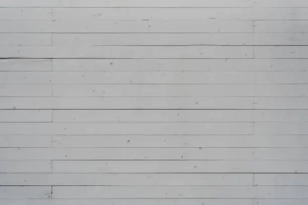 weathered white colored wooden wall  texture with nail head