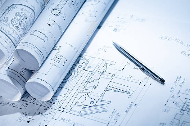 Engineering blueprint Some mechanical parts drawings on a table with a penSome mechanical parts drawings on a table with a pen and glasses blueprint industry work tool planning stock pictures, royalty-free photos & images