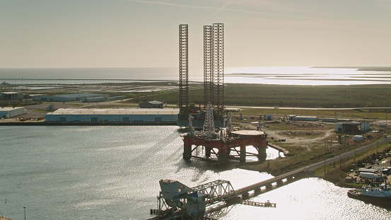 Aerial shot of shipyard repairing offshore drilling platforms in Pascagoula, Mississippi a sunny afternoon.