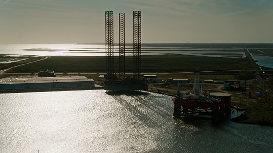 Aerial shot of shipyard repairing offshore drilling platforms in Pascagoula, Mississippi a sunny afternoon.