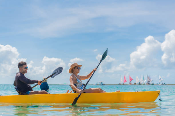 istock Couple with kayak on the beach 1402204571
