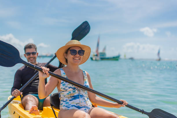 istock Couple with kayak on the beach 1402204574