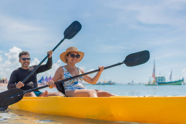 istock Couple with kayak on the beach 1402204575