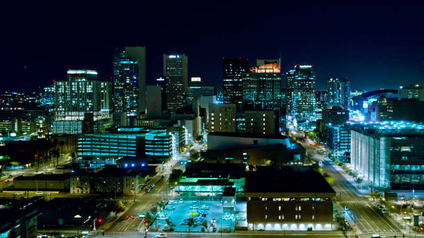 istock Downtown Phoenix Office Towers Lit Up at Night - Aerial 1402208153