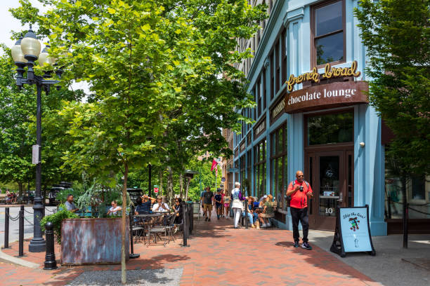 Asheville, NC, USA-5 June 2022: Sidewalk diners outside the French Broad Chocolate Lounge near Pack Square.