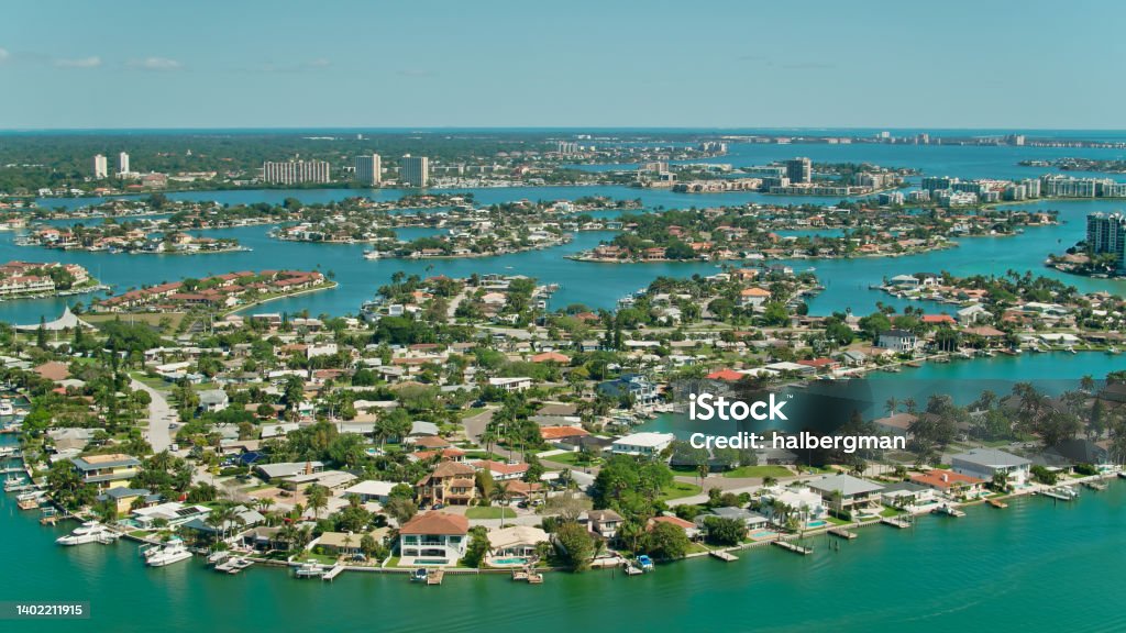 Aerial View of Homes and Waterways in St. Petersburg, Florida Aerial shot of islands in the waterway between St. Petersburg, Florida and the barrier island  on a sunny day.

Authorization was obtained from the FAA for this operation in restricted airspace. Florida - US State Stock Photo