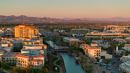 Aerial shot of Scottsdale, Arizona during a golden sunset in spring.\n\nAuthorization was obtained from the FAA for this operation in restricted airspace.