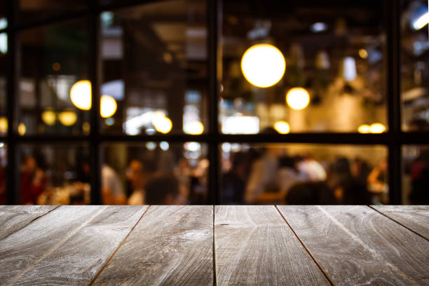 istock Closeup top wood table with blur background. 1402215822