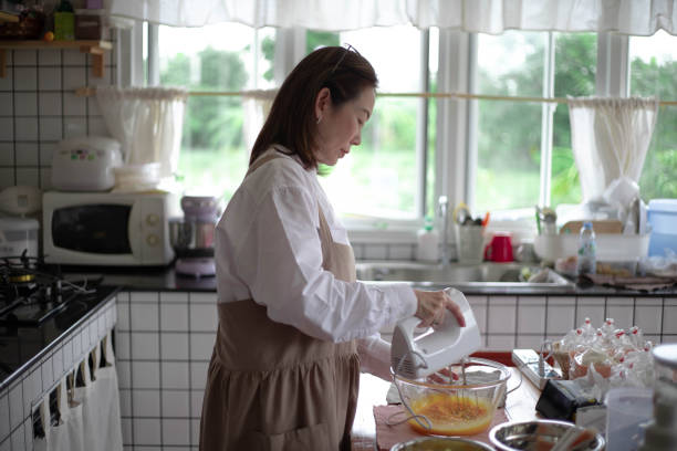 istock Beautiful female woman baking macaroons 1402216652