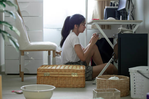 istock woman cleaning her home office 1402216805