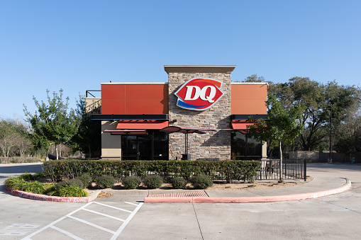 Pearland, TX, USA - February 10, 2022: A Dairy Queen store in Pearland, TX, USA. Dairy Queen is an American chain of soft serve ice cream and fast-food restaurants.