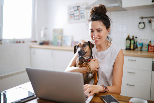 istock woman doing a video call with her pet 1402221486