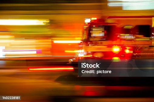 istock Emergency fire truck at the night 1402228181