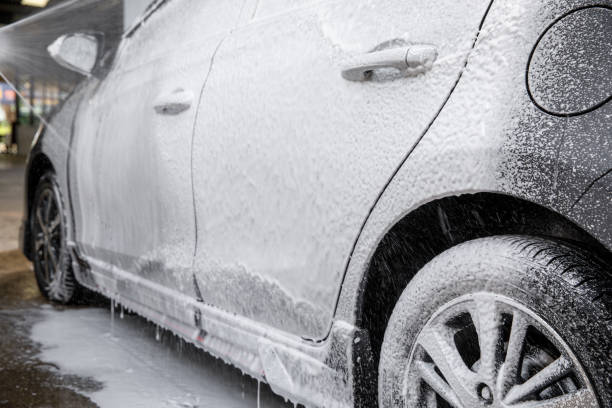 istock Car cleaning. Wash car with soap 1402230144