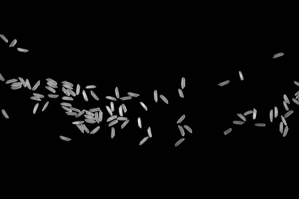 istock Pile of raw white rice. Floating. Isolated on black background. 1402236421