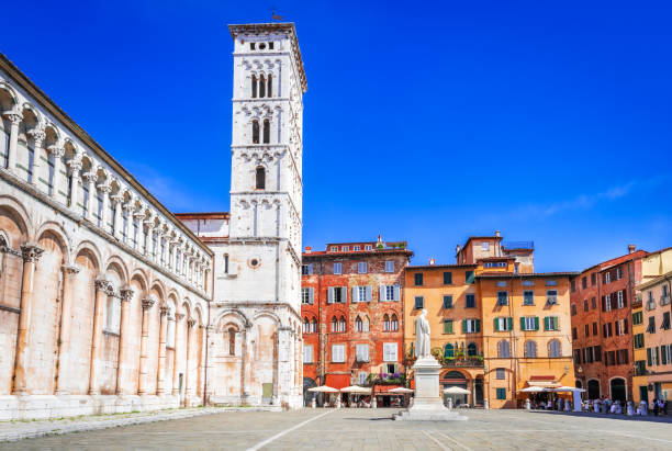 Lucca, Italy - Tuscany scenic architectural background, Chiesa di San Michele Lucca, Italy. Church San Michele in Foro, historical centre of old medieval town Lucca in summer day with clear blue sky, Tuscany. lucca stock pictures, royalty-free photos & images