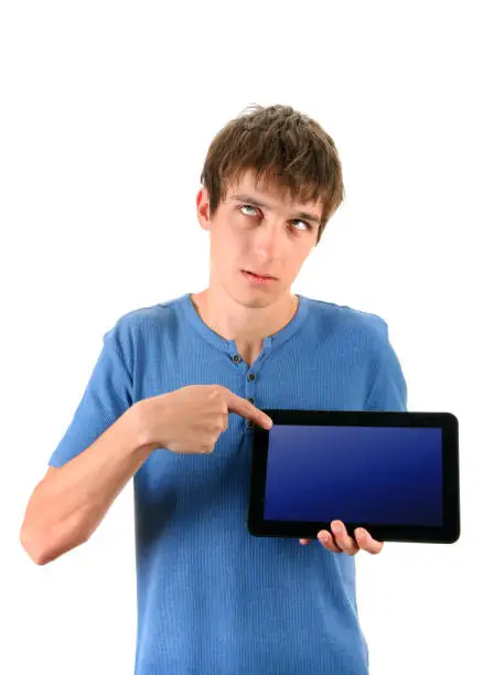 Annoyed Young Man with Tablet Computer Isolated on the White Background