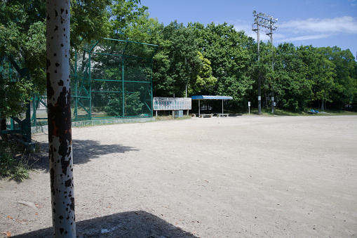 Dejimanishi Park in Hiroshima City, Hiroshima Prefecture, Japan. A park with a playground and a baseball field.