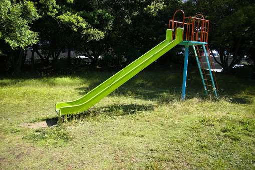 Dejimanishi Park in Hiroshima City, Hiroshima Prefecture, Japan. A park with a playground and a baseball field.