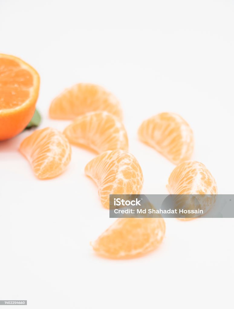 slice Tangerine or kamala or orange over on white background,top view Bangladesh Stock Photo