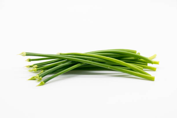 istock chives or garlic chives isolated on white . 1402255571