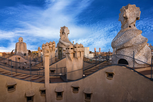 Barcelona, Spain - May 30, 2022: Casa Mila (La Pedrera) chimneys by famous Catalan architect Anthoni Gaudi.