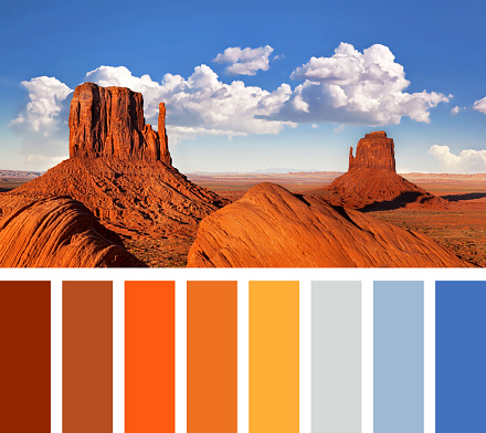 The iconic Mitten Butte rock formations of Monument Valley, in a colour palette with complimentary swatches
