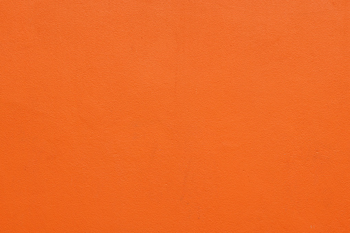 Part of a bright orange wall.
