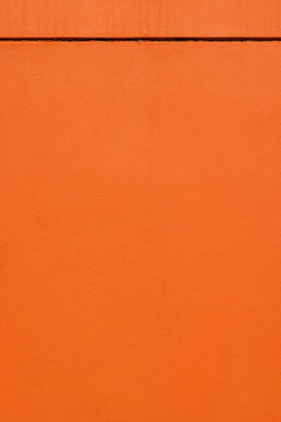 istock Part of a painted orange concrete wall 1402260052