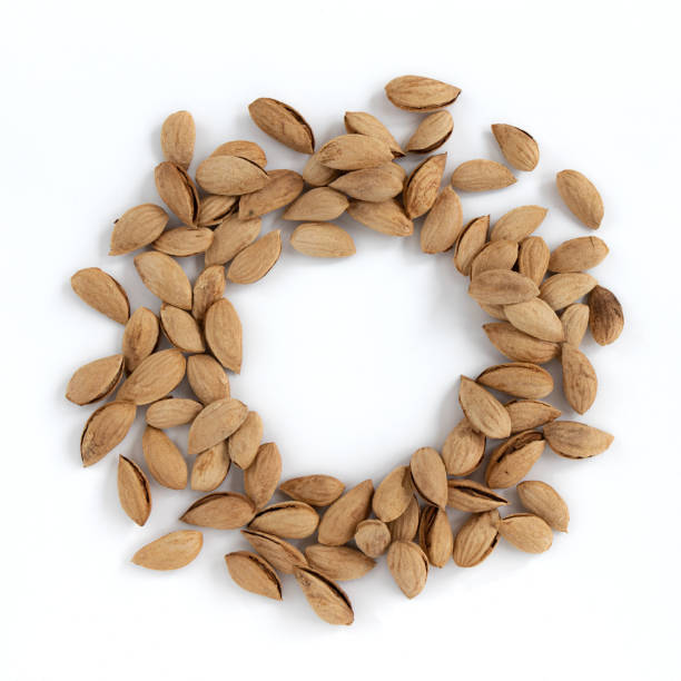 istock heap of unpeeled almonds isolated on white background 1402262205