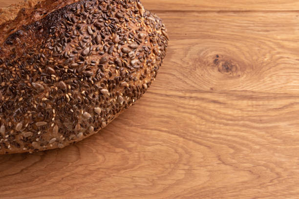 istock fresh homemade bread on wooden background, side view 1402262215