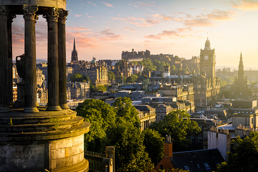 Holidays in Scotland - Dugald Stewart Monument and view over historic Edinburgh from Calton Hill