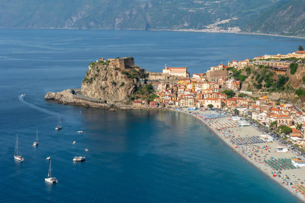 Beach of Scilla in Calabria, panoramic view with Castello Ruffo and townscape Scilla is a small tourist town located on the Tyrrhenian coast of Calabria castle scilla stock pictures, royalty-free photos & images