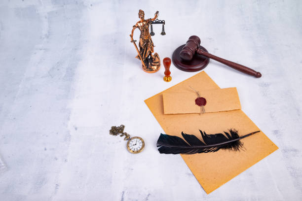 istock Notary's public pen and stamp on testament and last will. Notary public tools 1402267000