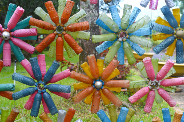 istock Flower shaped colourful decorations made of plastic bottles 1402268167