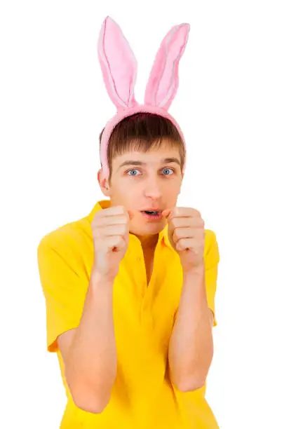 Young Man with Bunny Ears threaten with a Fist Isolated on the White Background