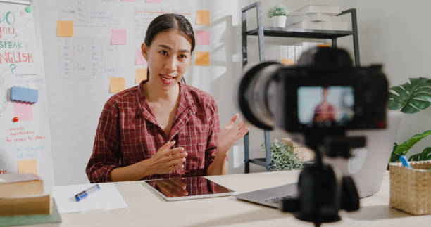 young woman teacher teaching online lesson class on video call via camera at home. - youtube home video camera internet ipad imagens e fotografias de stock