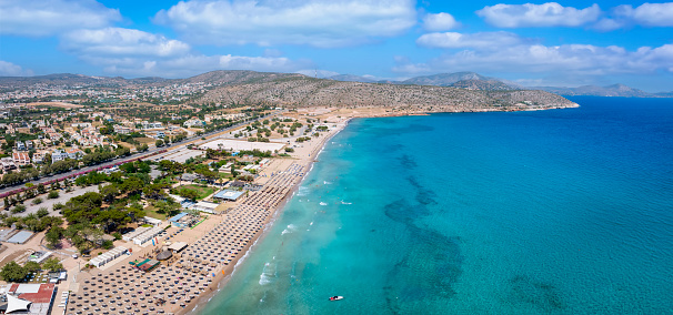 Aerial panorama of the turquoise sea of the holiday suburb Varkiza Beach at the south coast of Athens, Attica, Greece