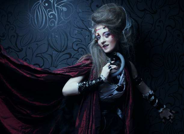 istock Young woman with creative make up in a red raincoat 1402272844