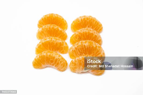 Some Pieces Of Tangerine Isolated On White Background Stock Photo - Download Image Now