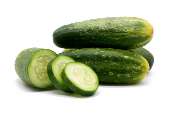 istock Fresh cucumber slices over on background. 1402273642