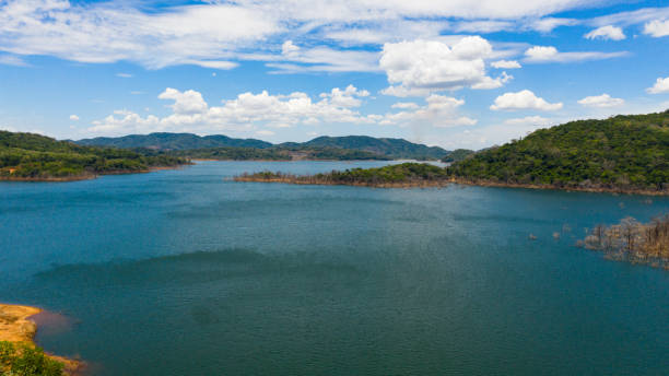 istock Jungle mountains and blue lake. 1402274397
