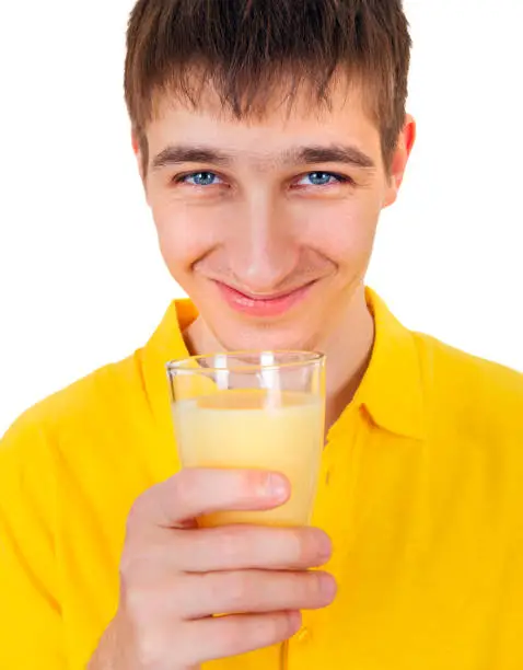 Young Man with a Fruit Juice Isolated on the White Background