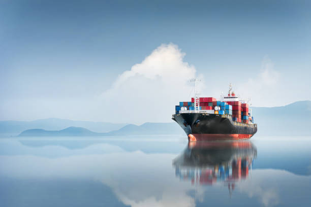 istock Container cargo ship in the ocean at sunset blue sky background with copy space, Global business logistics import export goods of freight carrier, transportation industry concept, Sea Freight Shipping 1402279873