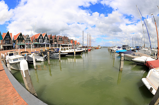 Volendam, the Netherlands - May 24, 2022: Visiting the Harbor of Volendam in North Holland a sunny day in May.