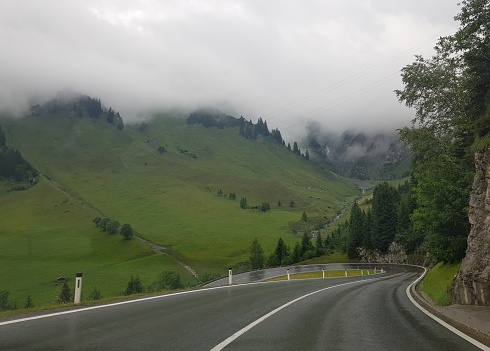 Winding mountain road photo, taken while driving.