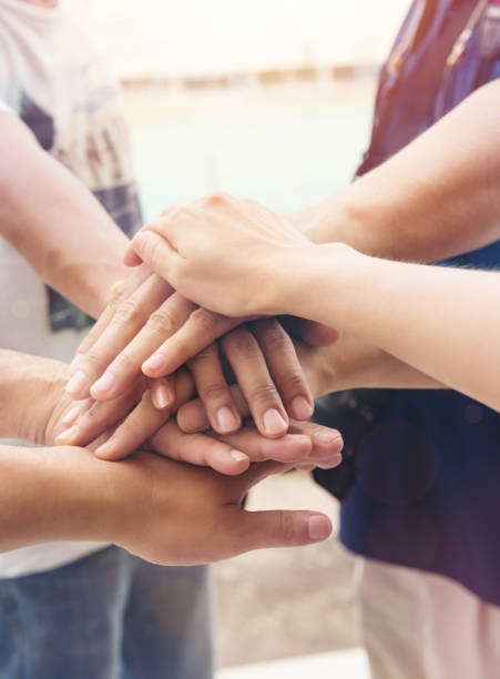 istock Together collaborate of hands teamwork outdoor 1402294414
